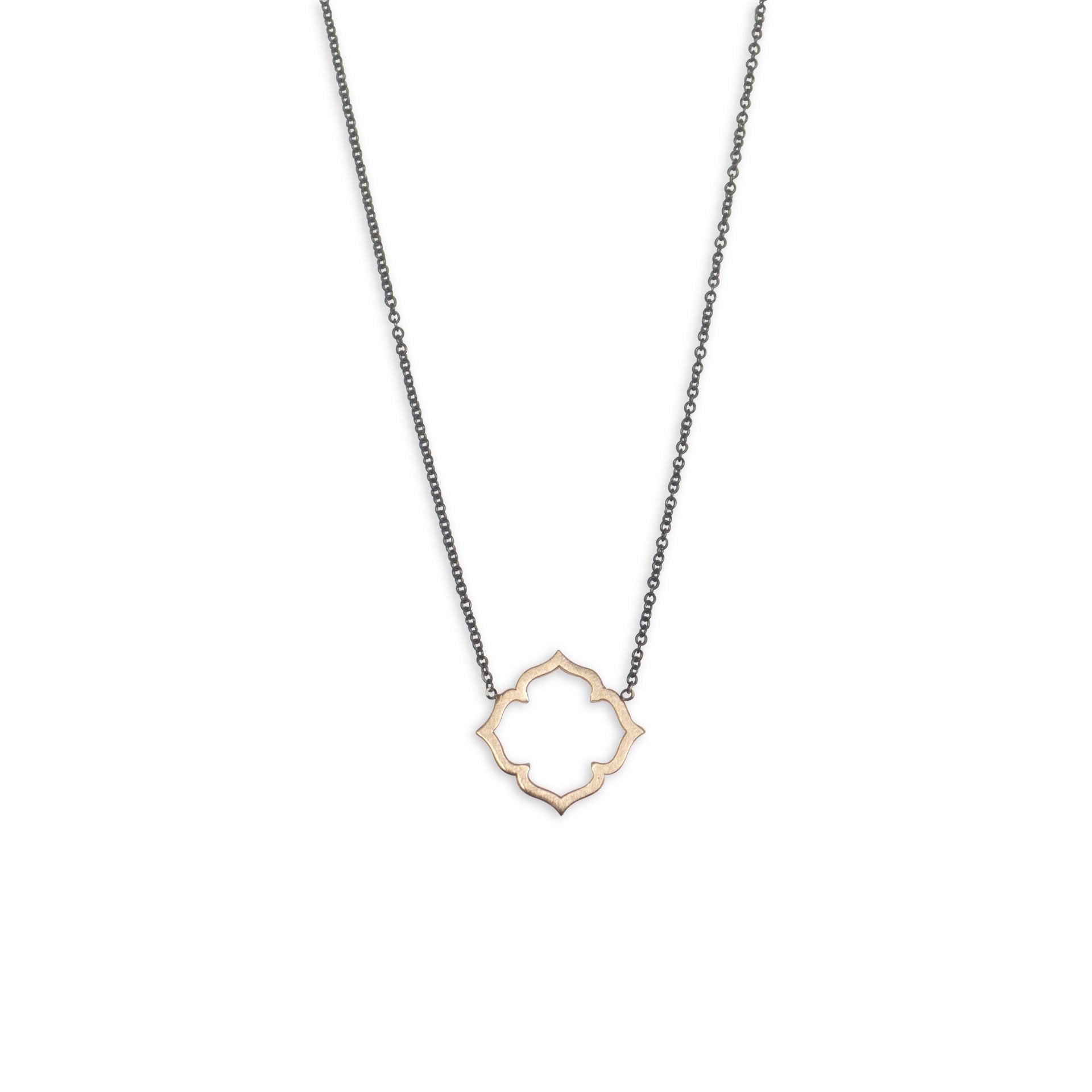 14k yellow gold on an oxidized chain clover necklace