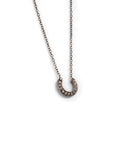 14k white gold with white diamonds plated in black rhodium / small diamond crescent necklace