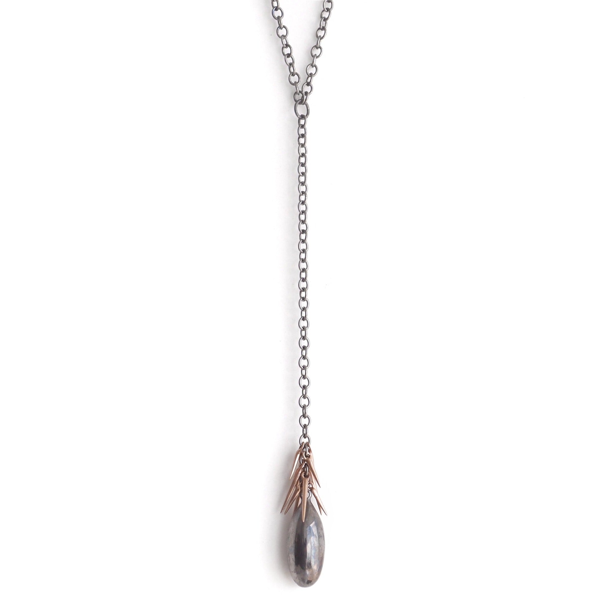 black rhodium pendant with 14k rose gold points small point lingham necklace