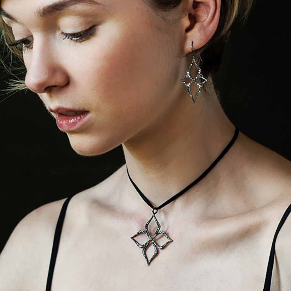black diamond arabesque earrings and pendant on model