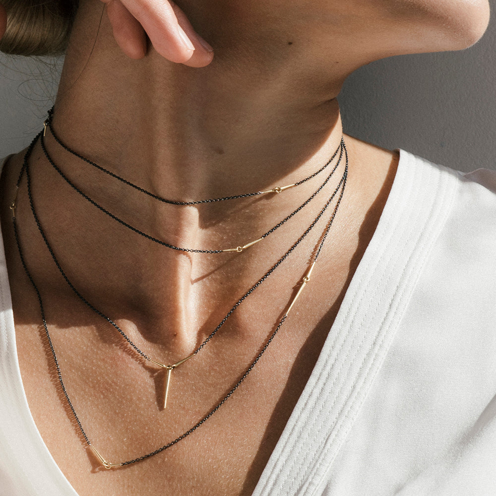 layered necklaces on model
