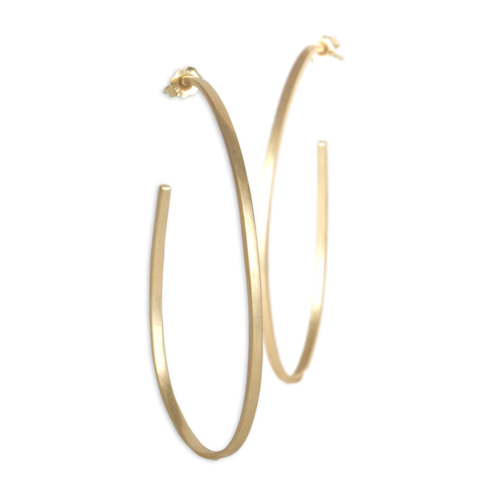 oval sliver hoops in 14k yellow gold