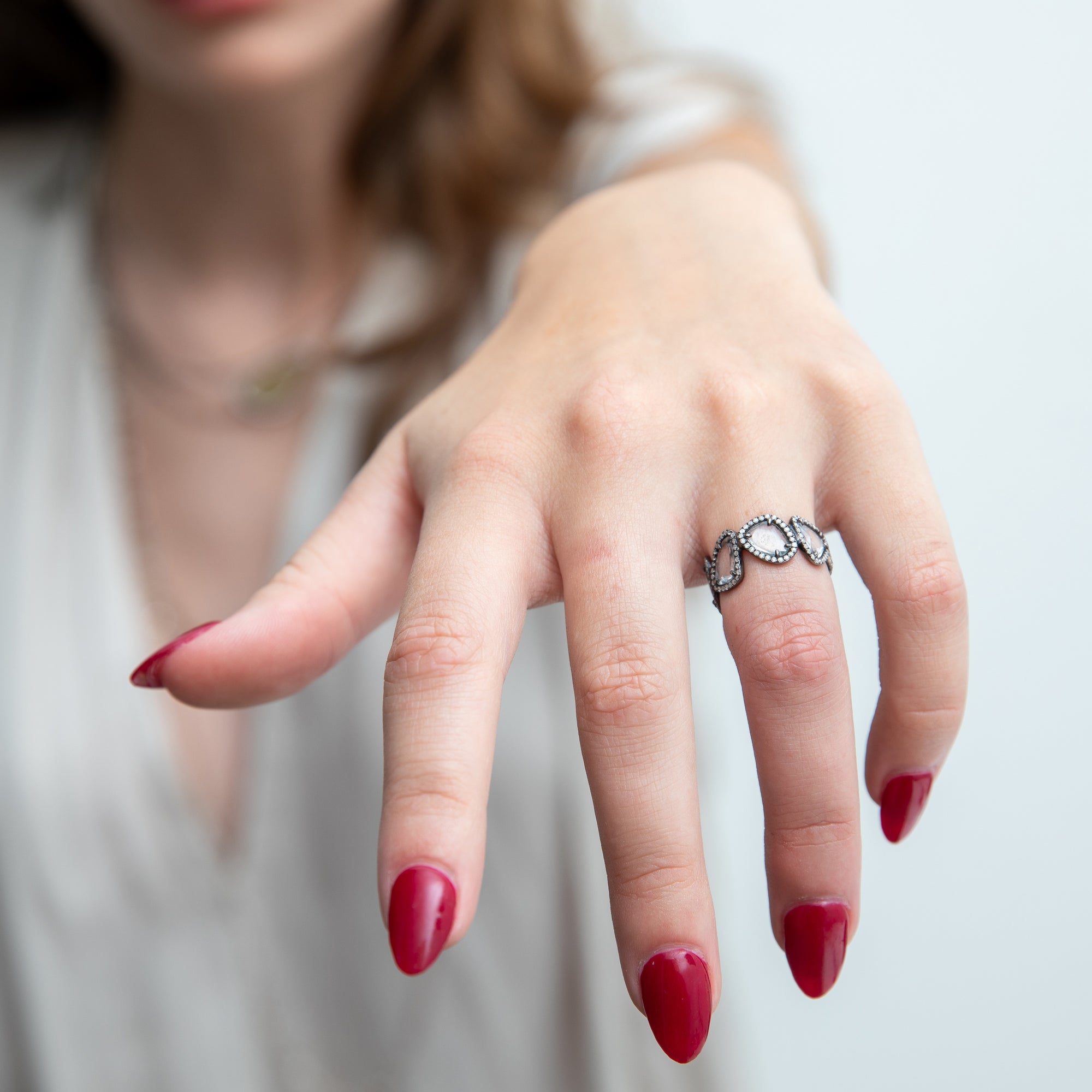 white sapphire and pavé diamond eternity band on model