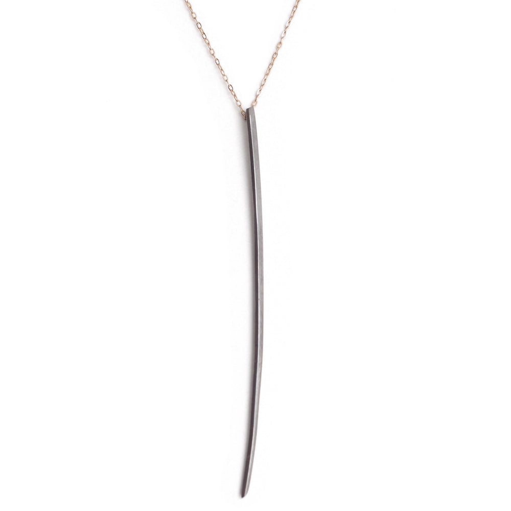 sterling silver plated in black rhodium on 14k yellow gold chain long stake pendant