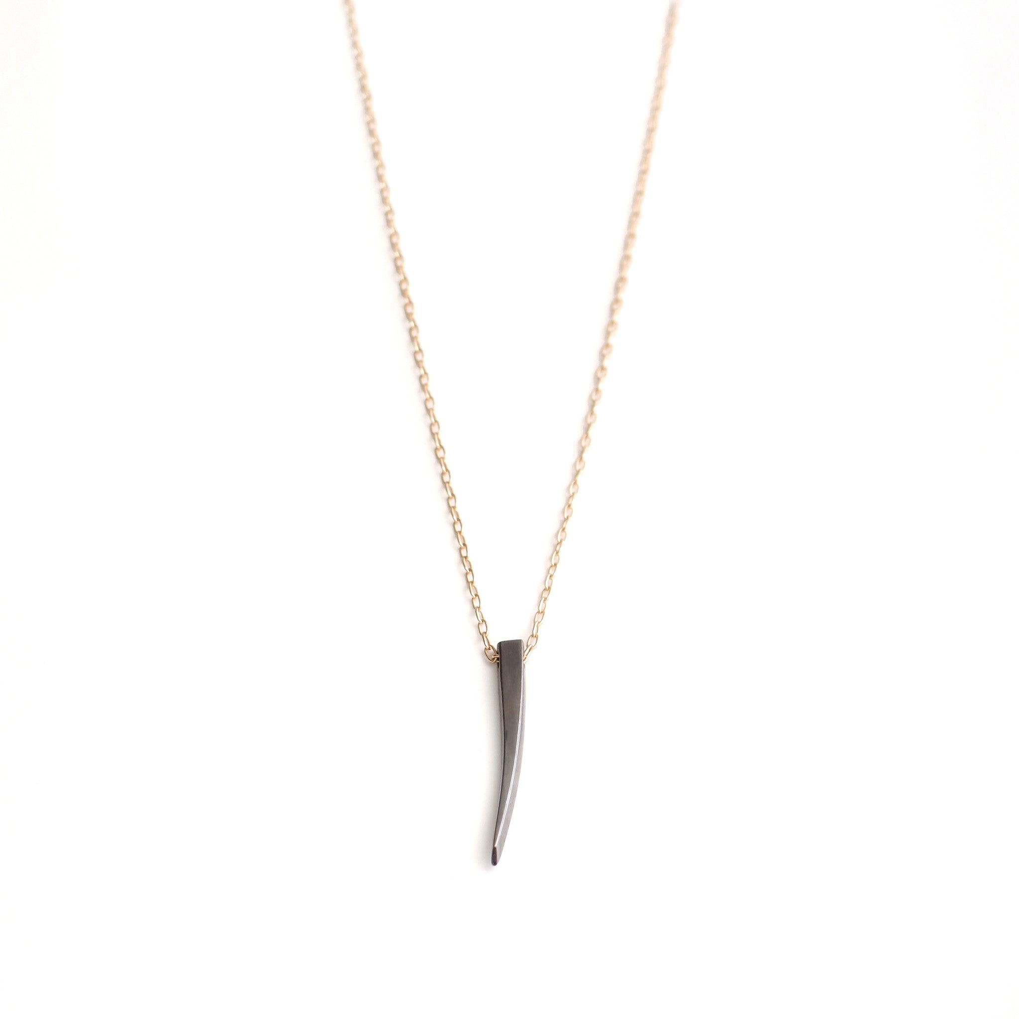 sterling silver plated in black rhodium on a 14k gold chain stake pendant