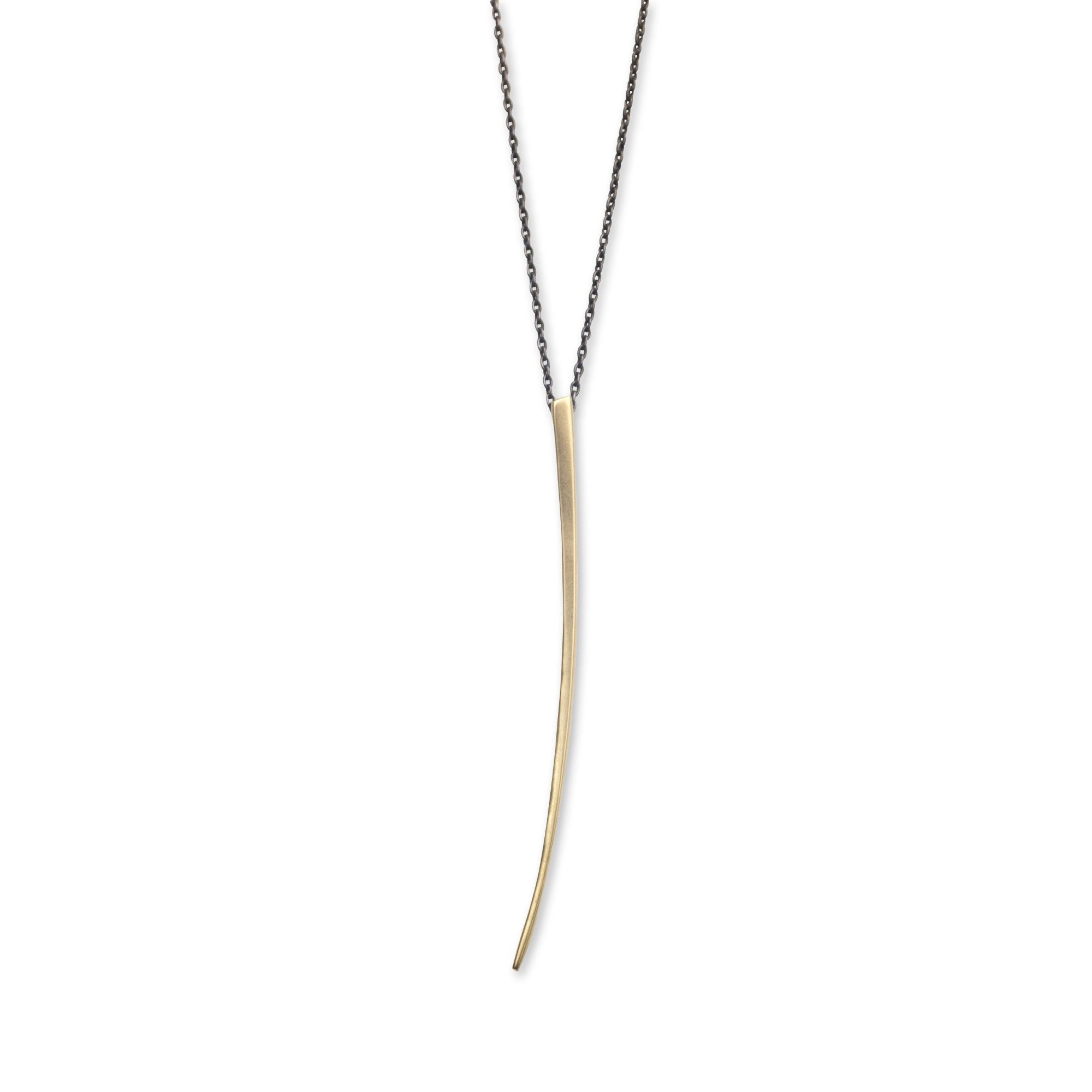 14k yellow gold pendant on an oxidized silver chain curved stake pendant