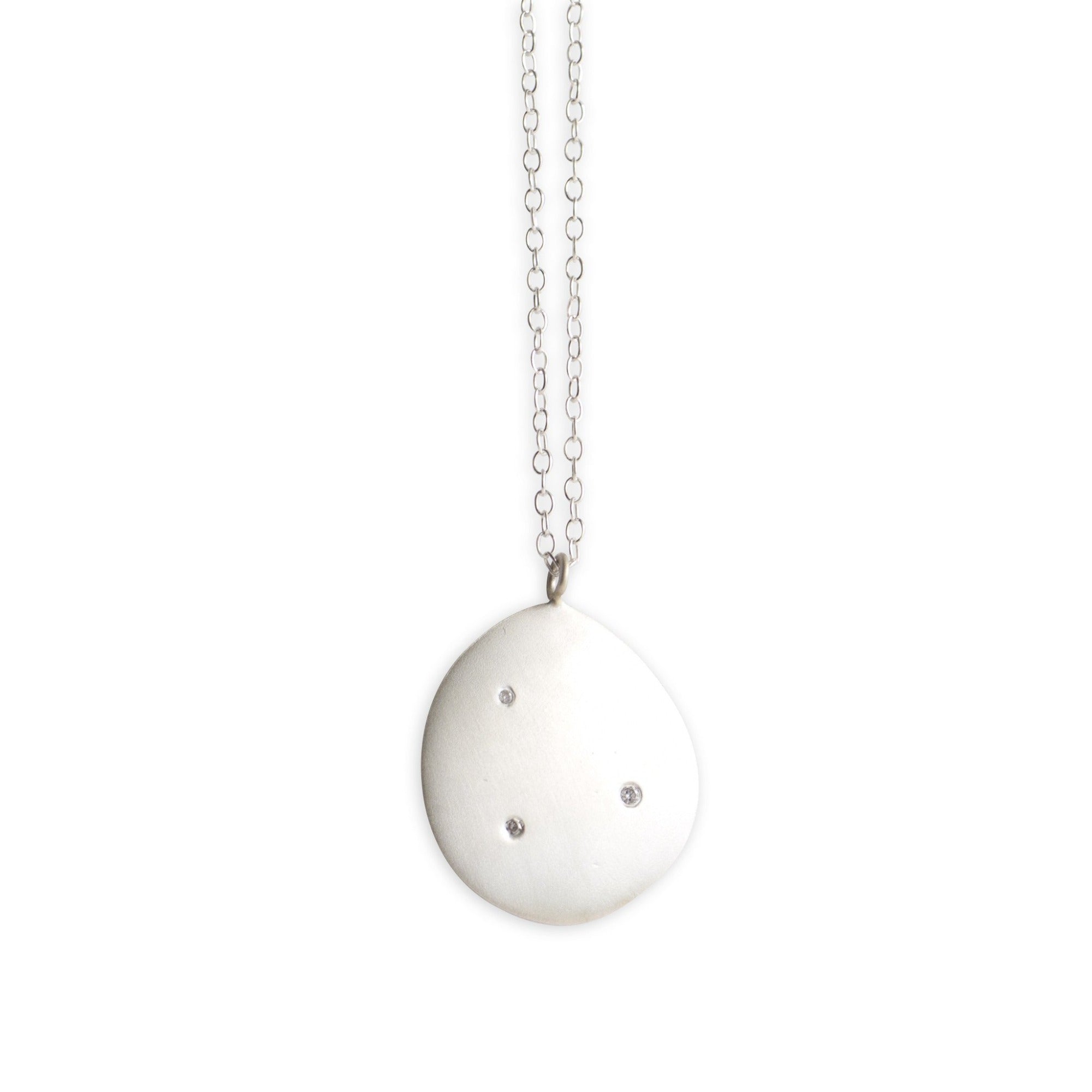 sterling silver on a sterling silver chain with white diamonds large disc pendant